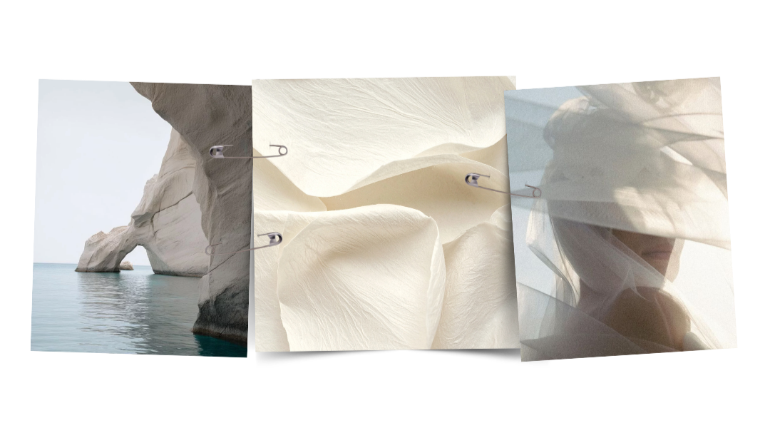 A large natural arch rock formation in the ocean, with a woman wearing a sheer white hat and veil, reflected on a piece of fabric with safety pins.