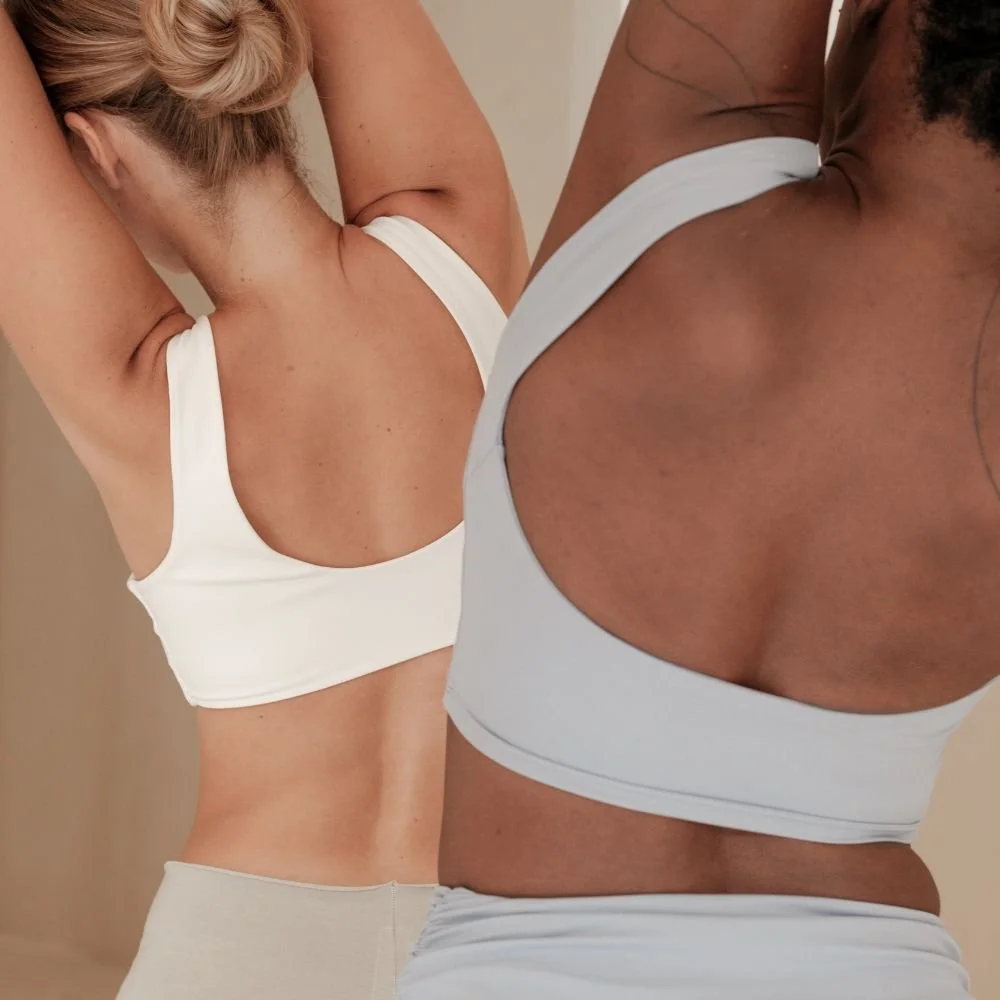 women stretching in activewear for Pilates.