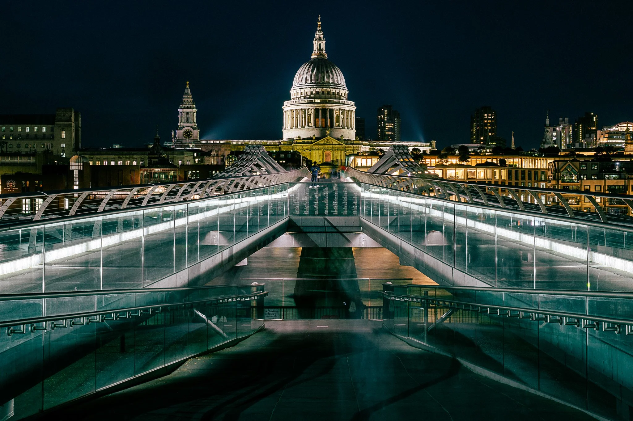 St. Paul's Cathedral at night looking across the Millennium Bridge