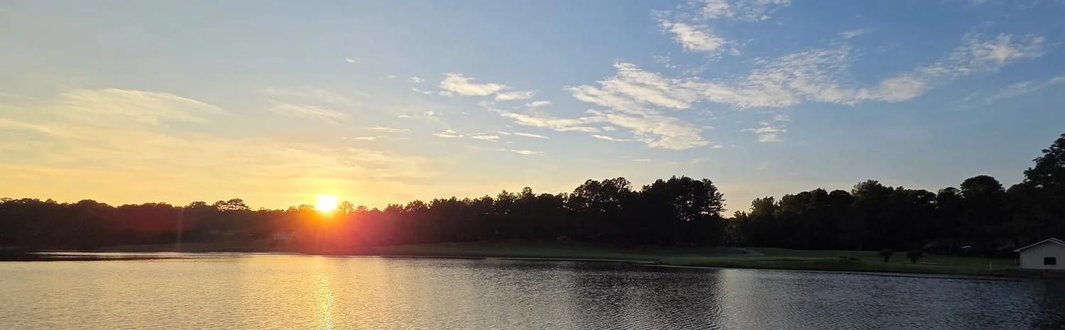 Sunset over the lake at hole 14