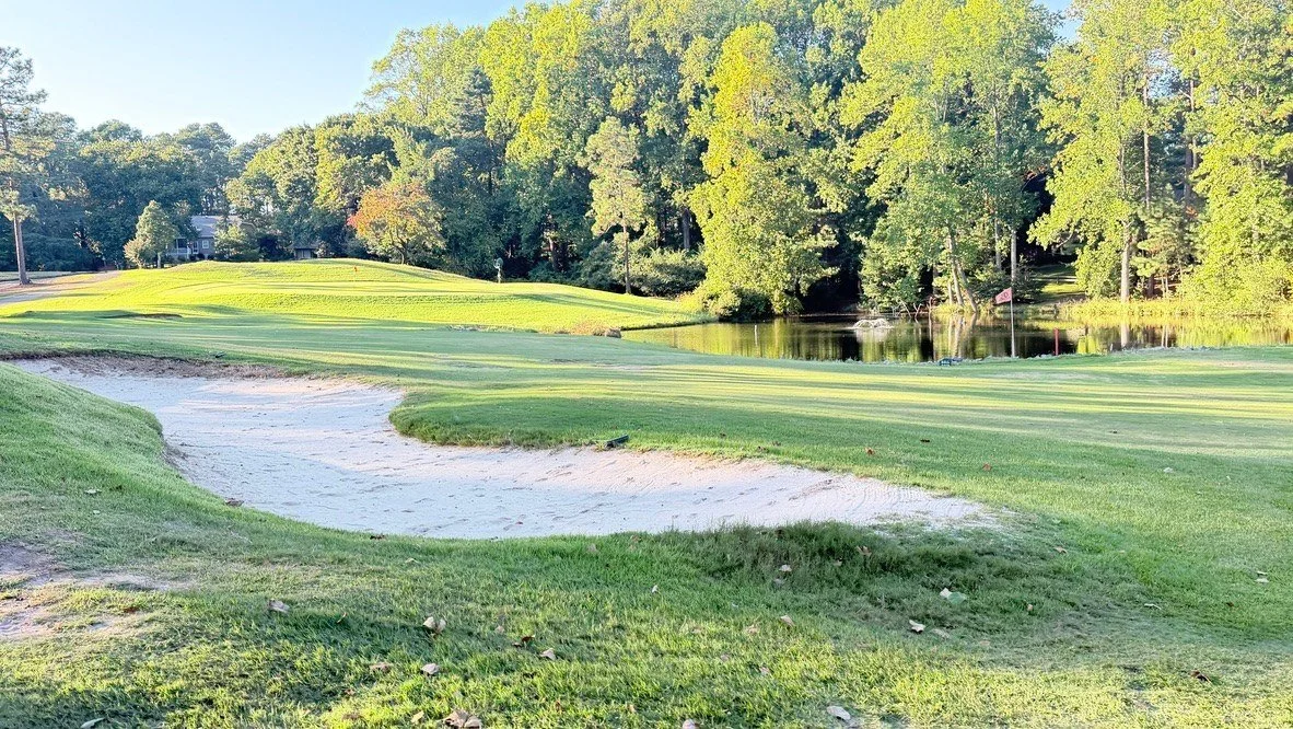 Bunker on the approach to hole 4, with the pond beyond