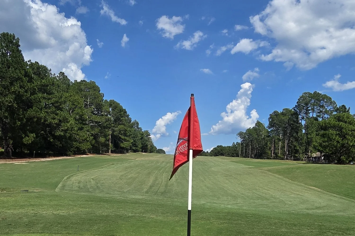 Flagstick on the hole 1 green
