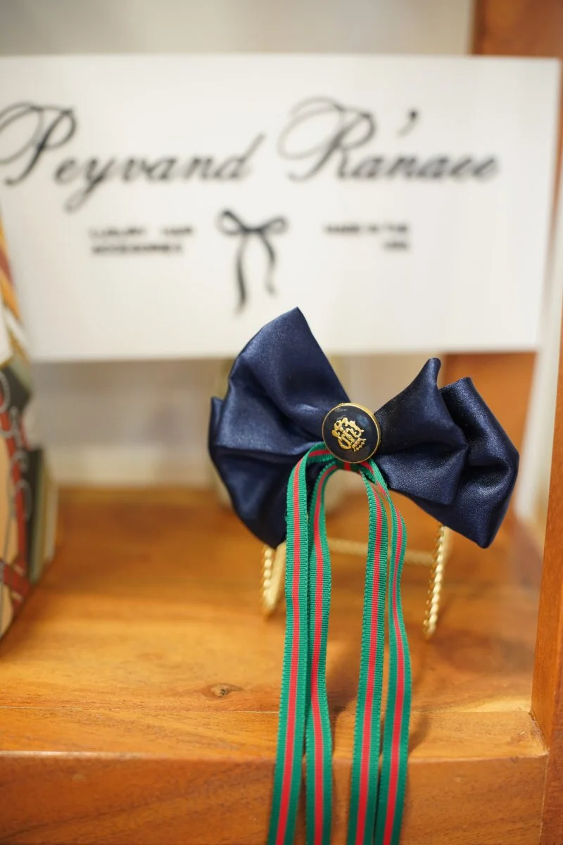 Blue, green, red and gold bow