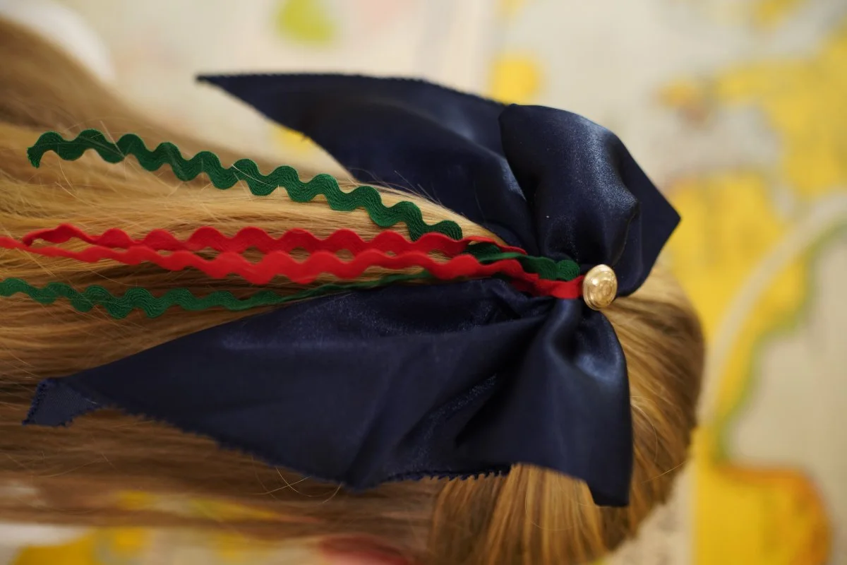 red, green and navy bow