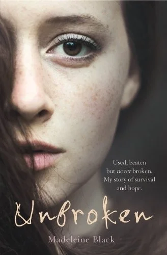 Dark book cover with young woman's face and light brown and white text.