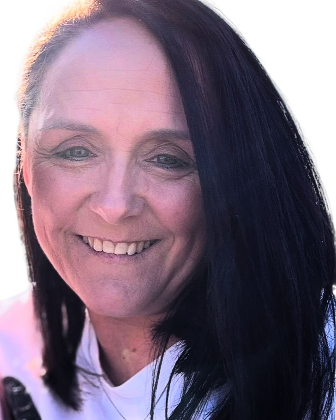 Smiling Scottish Caucasian woman with dark brown long straight hair wearing a white top.