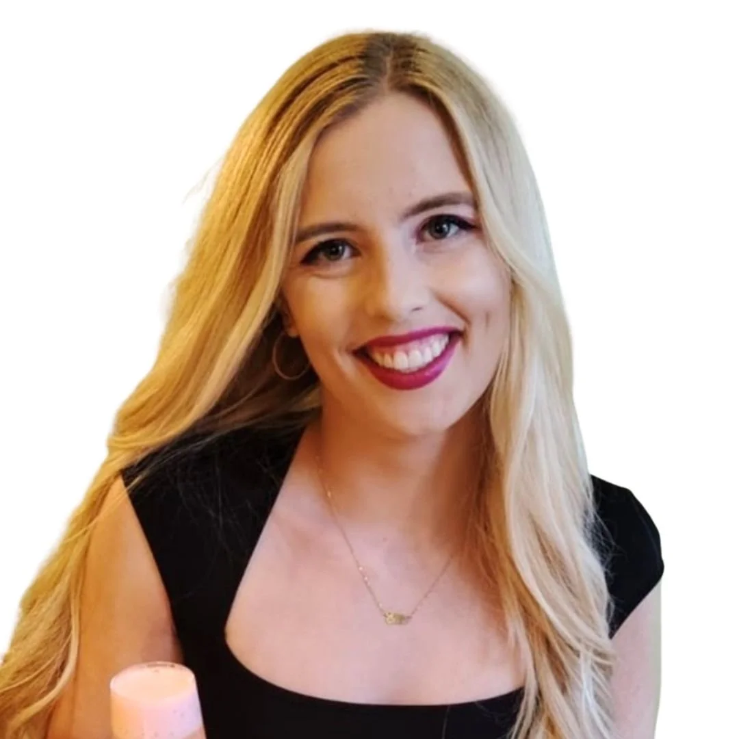 Smiling Scottish-Caucasian woman with long blonde hair wearing a black dress and silver necklace.