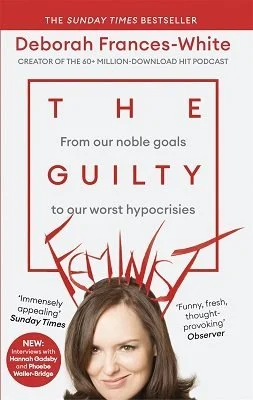 white colour book with red and black text and a photo of a woman with shoulder-length brown hair.