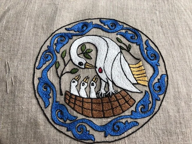 Commissioned Pelican badge. Embroidered using cotton floss in split stitch.
