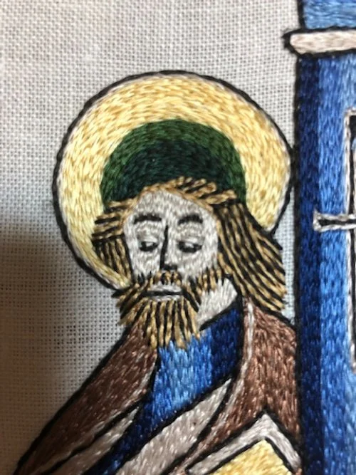 Detail of silk split stitch embroidery, showing stitch direction and surface texture.