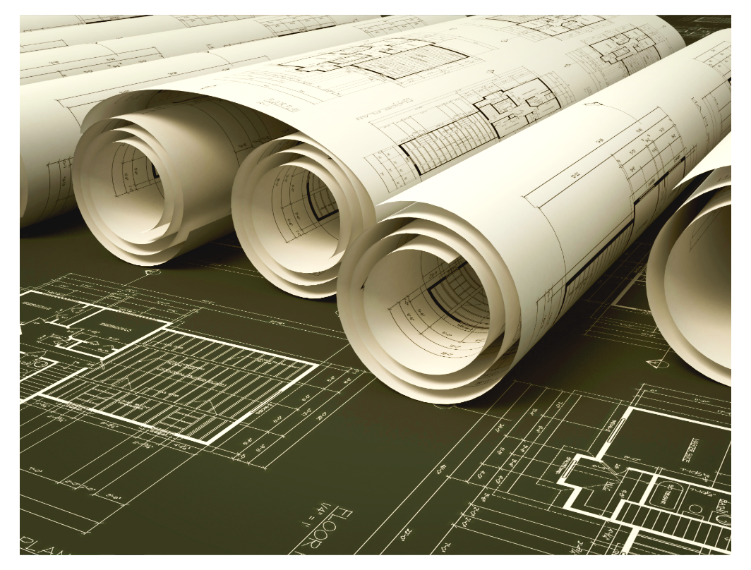 Rolled and unrolled architectural blueprints on a table, showing building floor plans.