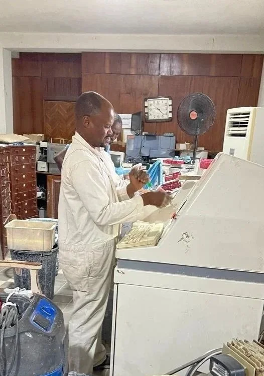 A man crafts lens blanks into custom prescription lenses at Omnivision, an opthalmology practice in Nigeria with an on-site lens factory