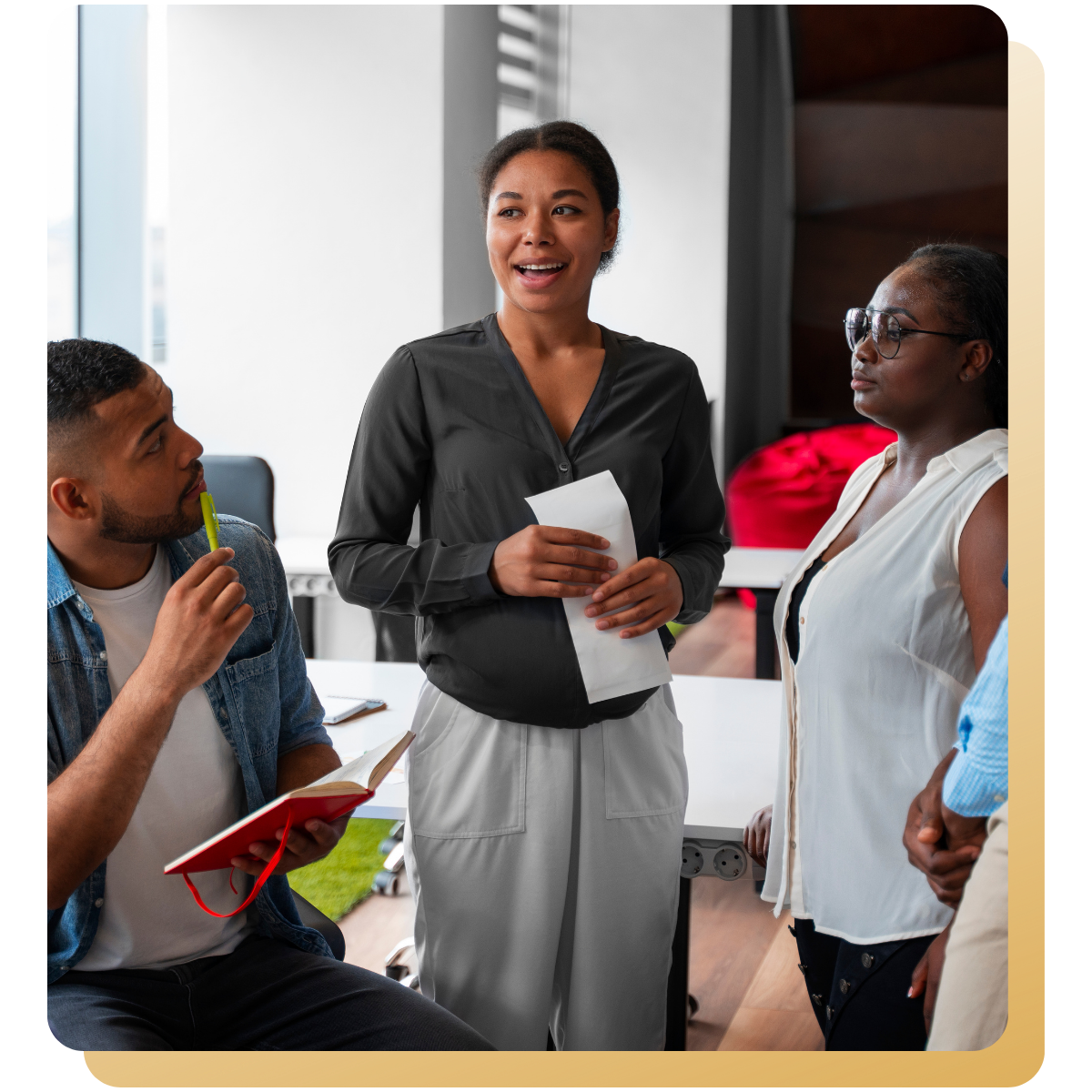 Group of professionals engaged in conversation during a team meeting, reflecting collaboration and shared leadership.