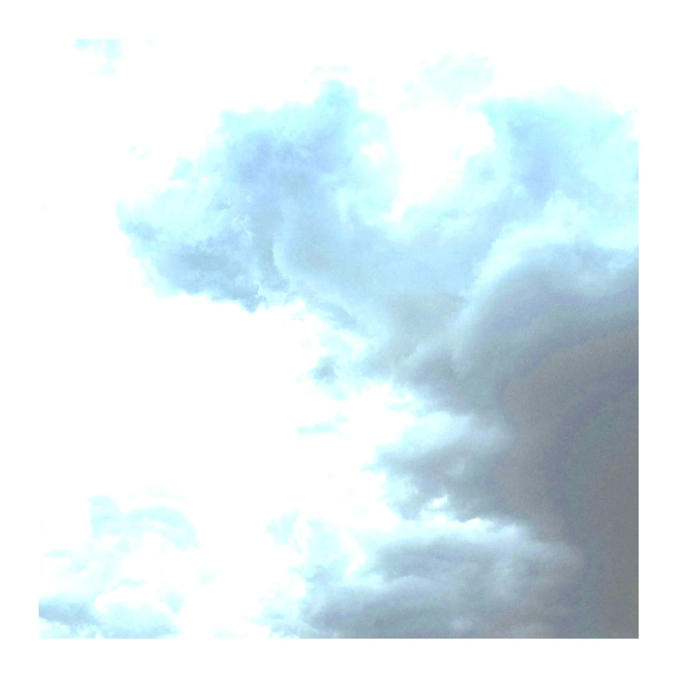 Sky with a mix of white and dark gray clouds, partly cloudy weather.