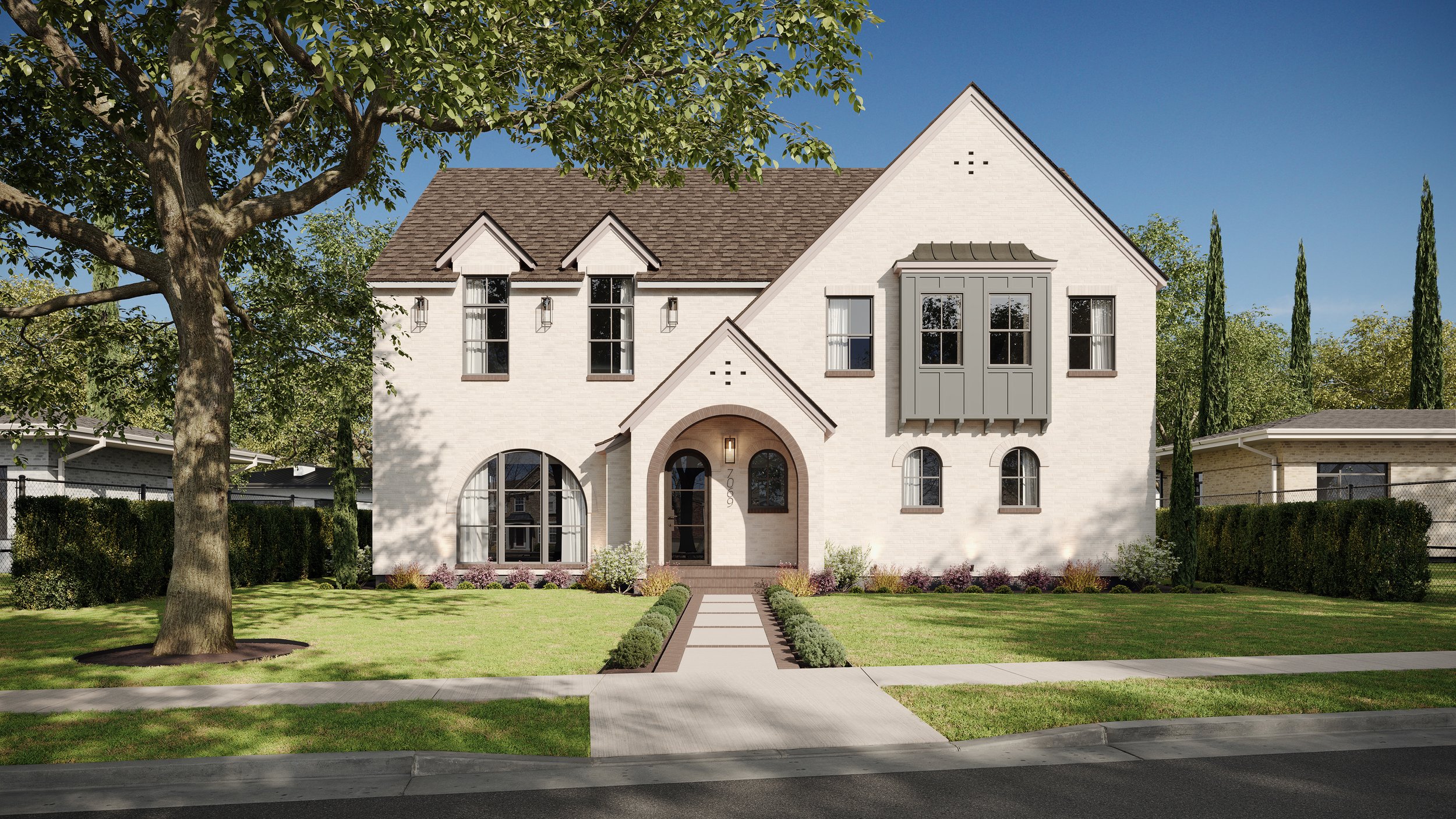 A modern two-story house with a white exterior, arched and rectangular windows, and a front porch with a curved archway. The house has a landscaped front yard with a concrete walkway, green lawn, and small bushes. There are tall trees and neighboring houses in the background under a clear blue sky.