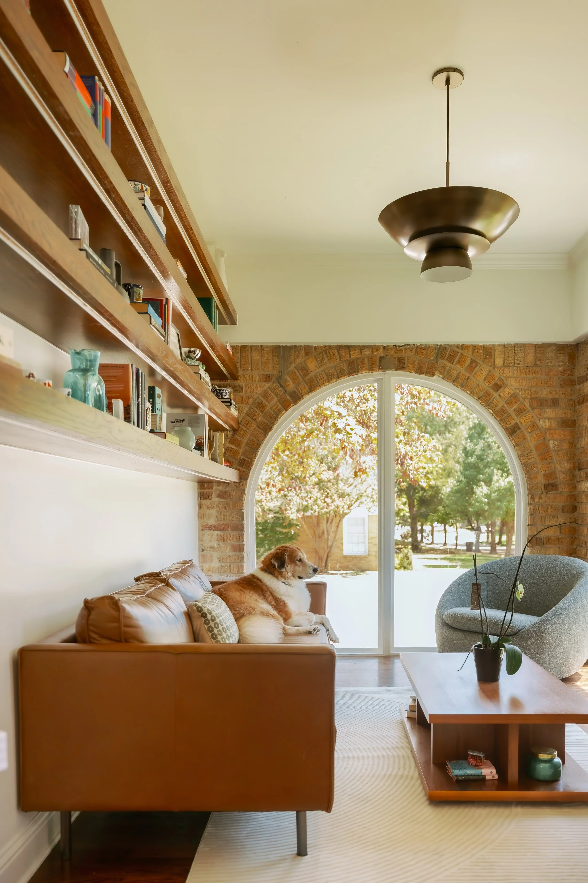 Whole-home renovation featuring an enclosed from porch with Arched windows in Dallas by Bella Vista Company