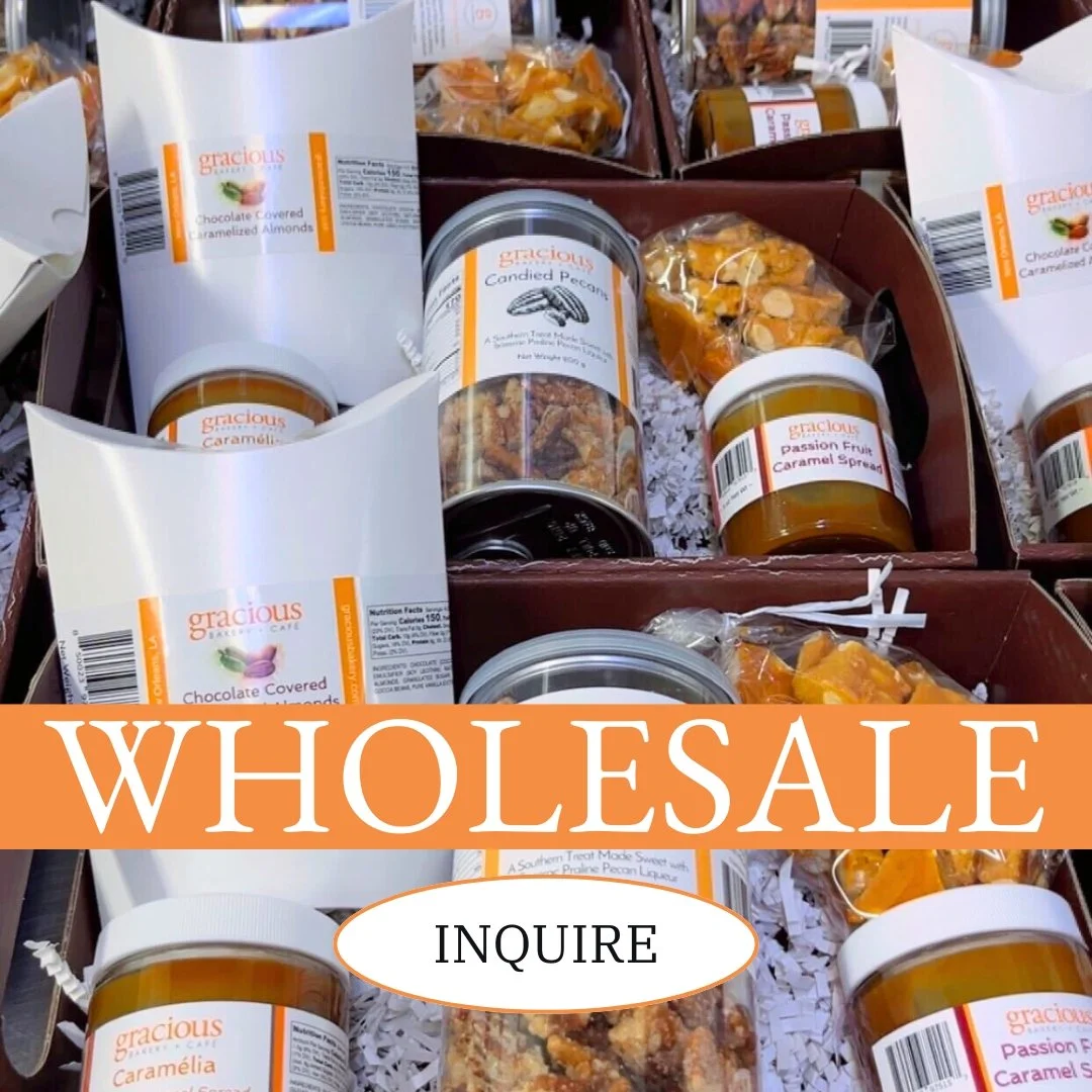 Assorted jars and containers of caramel spread, candied pecans, and chocolate-covered almonds arranged in a display box.