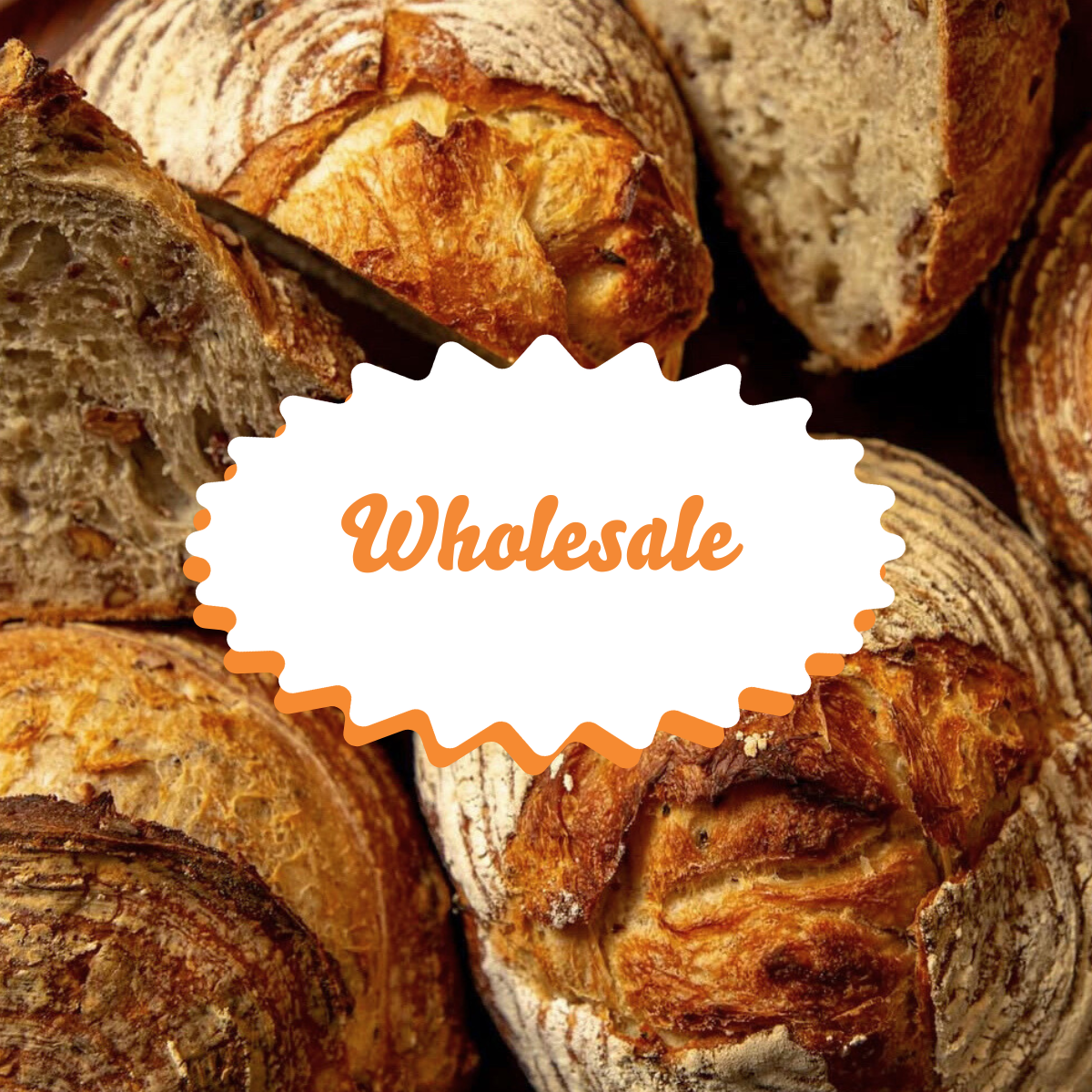close up image of a pile of sourdough breads with text that reads "wholesale"