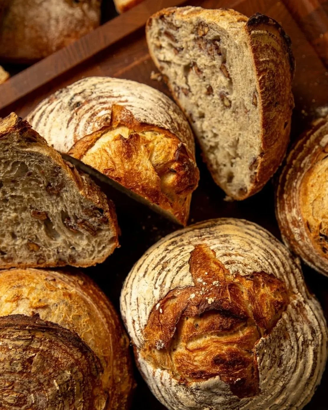 Image of stacked sourdough and nut breads from Gracious Cafe and Bakery in New Orleans, Louisiana.