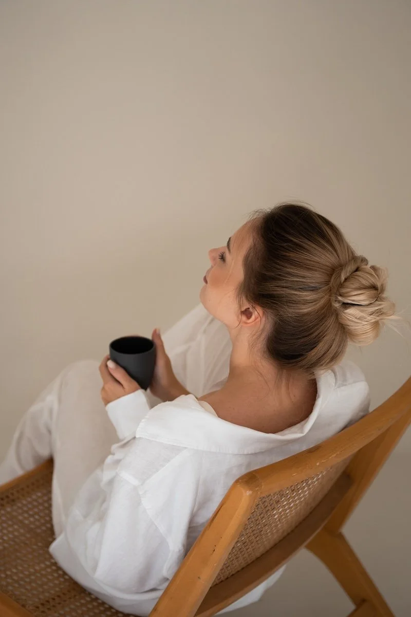 woman on chair with coffee