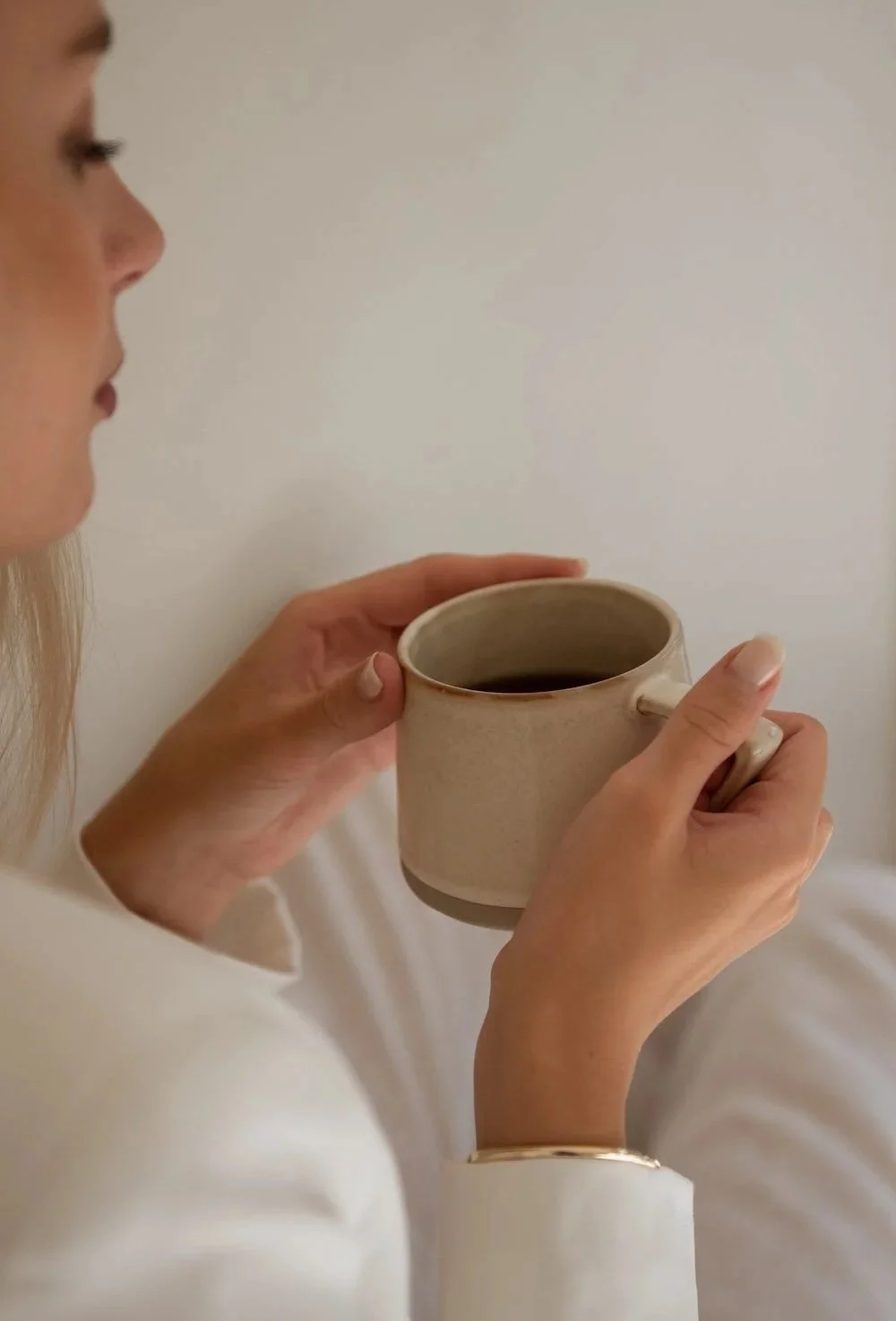 woman with coffee mug in hand