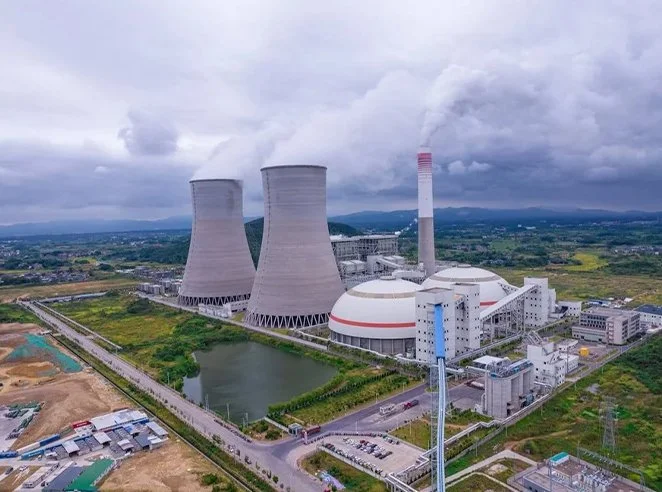 Marketing services for the nuclear power industry, concept image showing nuclear power plant infrastructure and related technology.