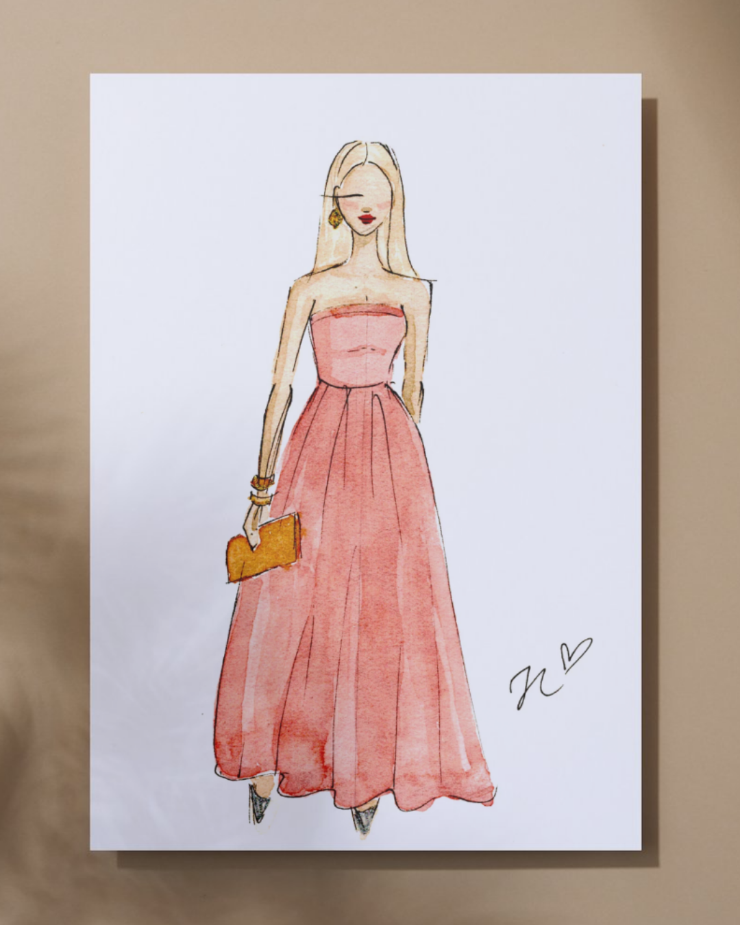 Watercolor fashion illustration of a woman in a strapless pink gown holding a small orange clutch, with personalized signature and heart symbol.