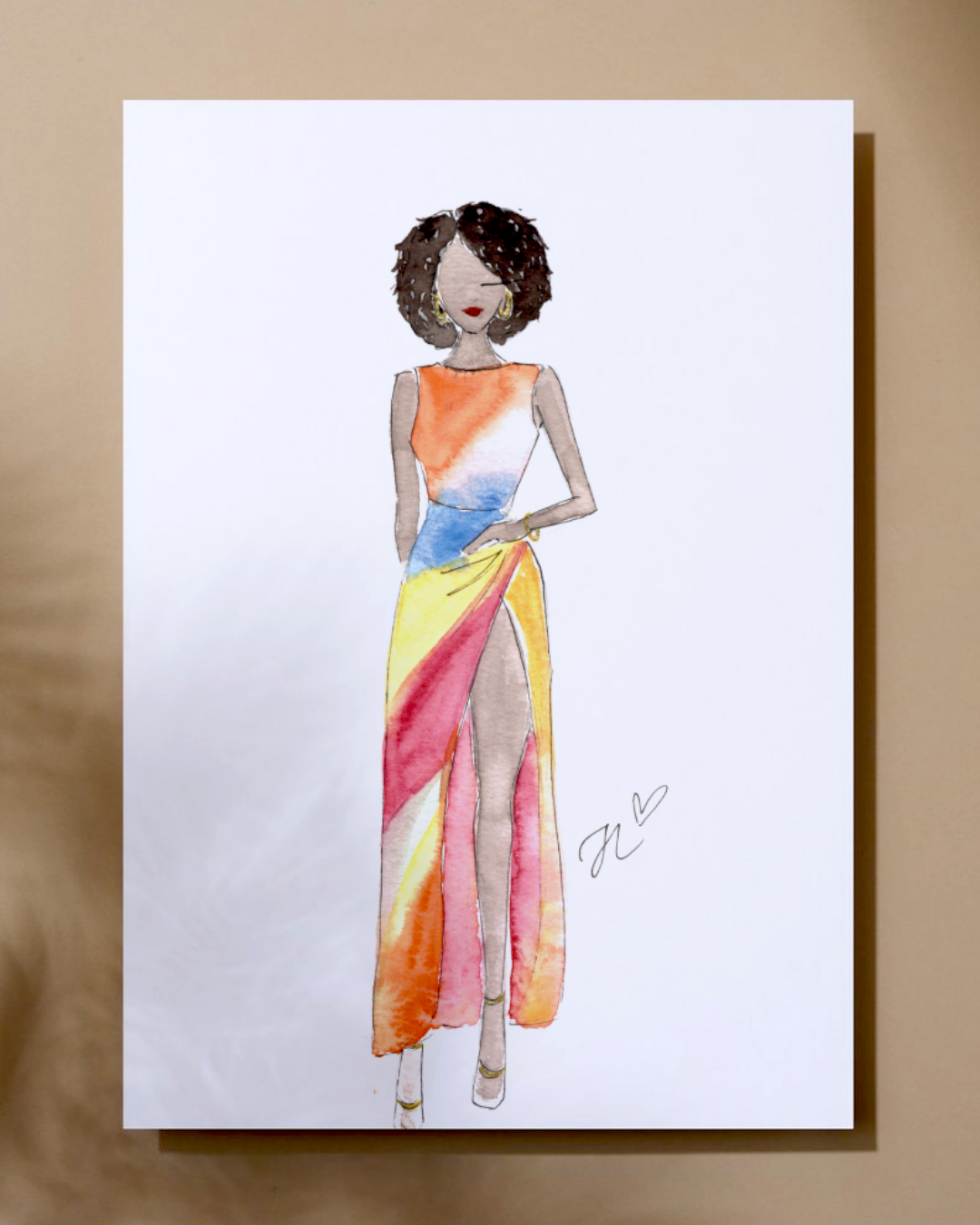 Watercolor fashion illustration of a woman in a colorful, sleeveless dress with a high slit, standing with one hand on her hip and wearing earrings and heels.
