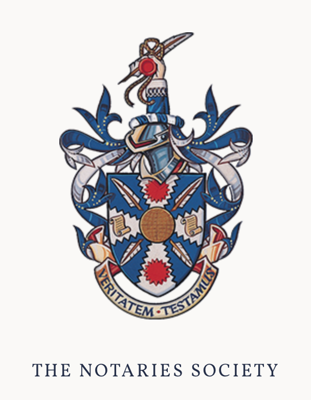 The Notaries Society coat of arms featuring a sword with a red pommel at the top, a shield with a blue background, and symbols such as a beehive, scrolls, and red flowers. A banner at the bottom reads 'VERITATEM TESTAMUS.'