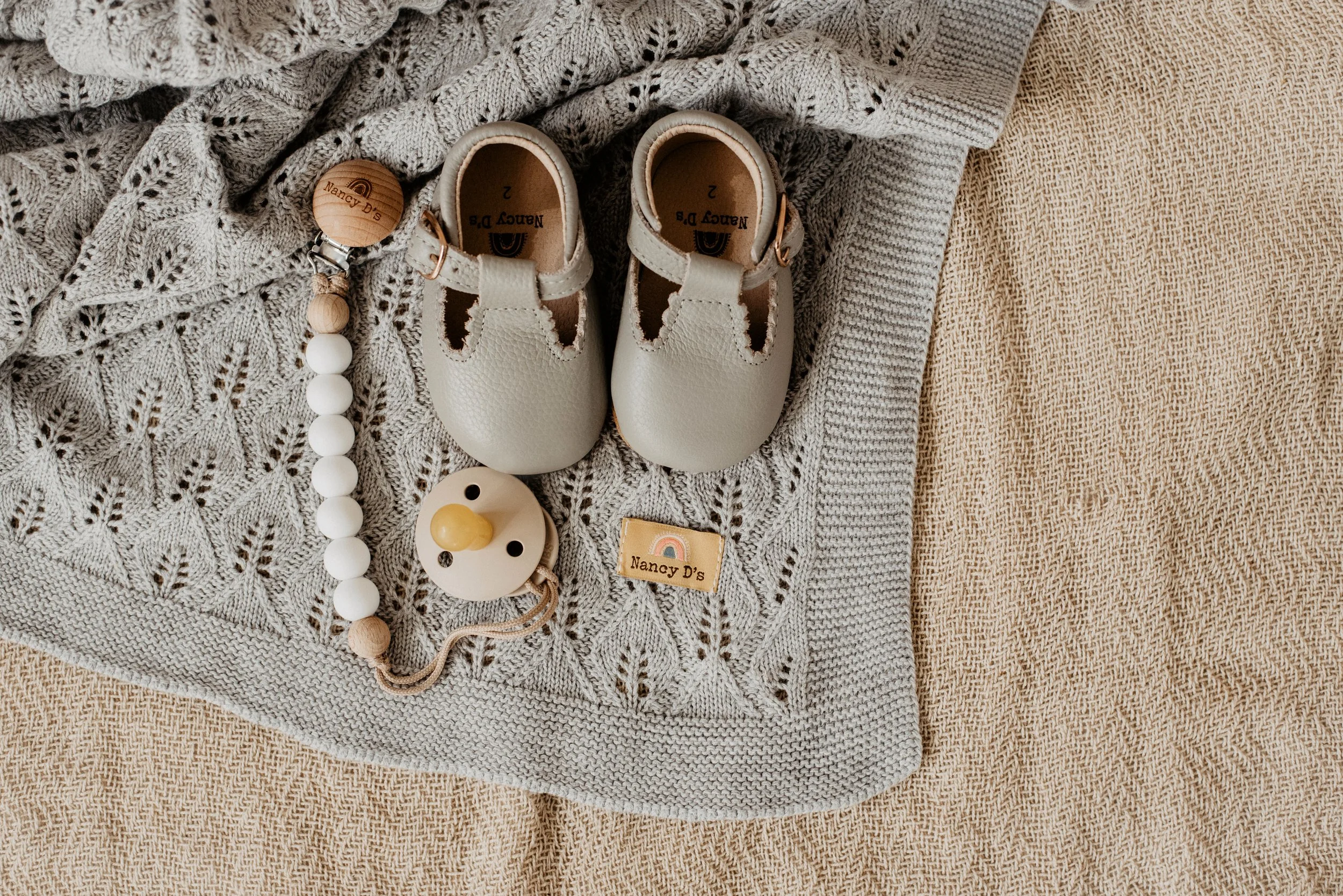 Nancy D's Nathan Blanket €43 Lillie Shoes €27 Marley Soother Clips €12.jpg