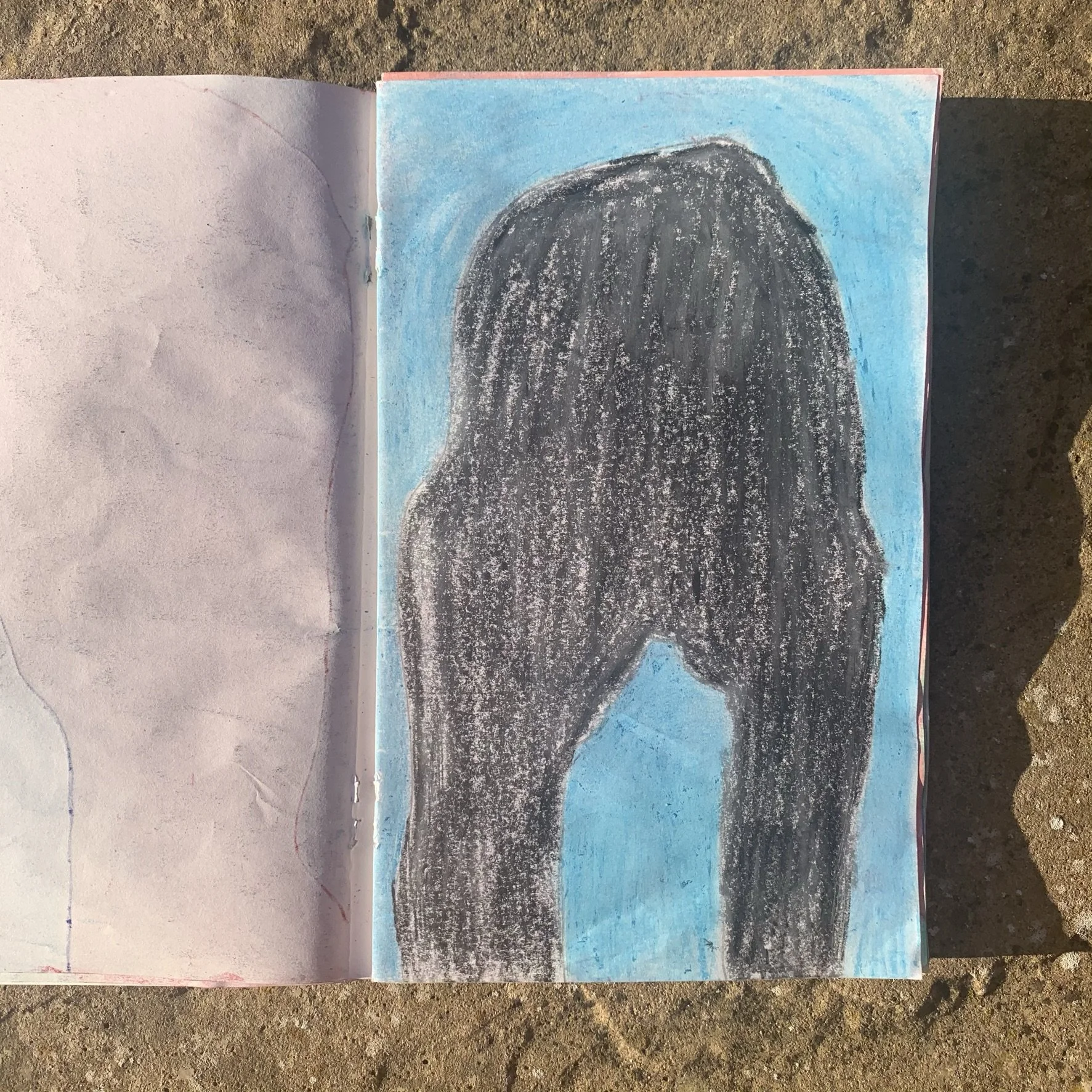 Colorful drawing of a large rock in dark graphite stick with aqua blue background in watercolour.