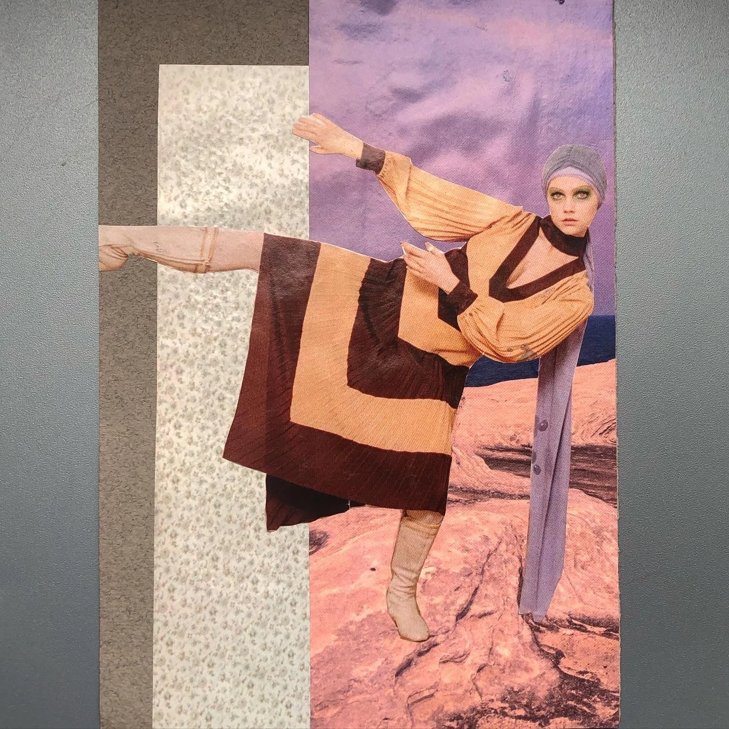 A collage featuring a woman with gray hair styled in a head wrap, wearing a beige and brown layered outfit, posed in front of a desert landscape with purple sky.