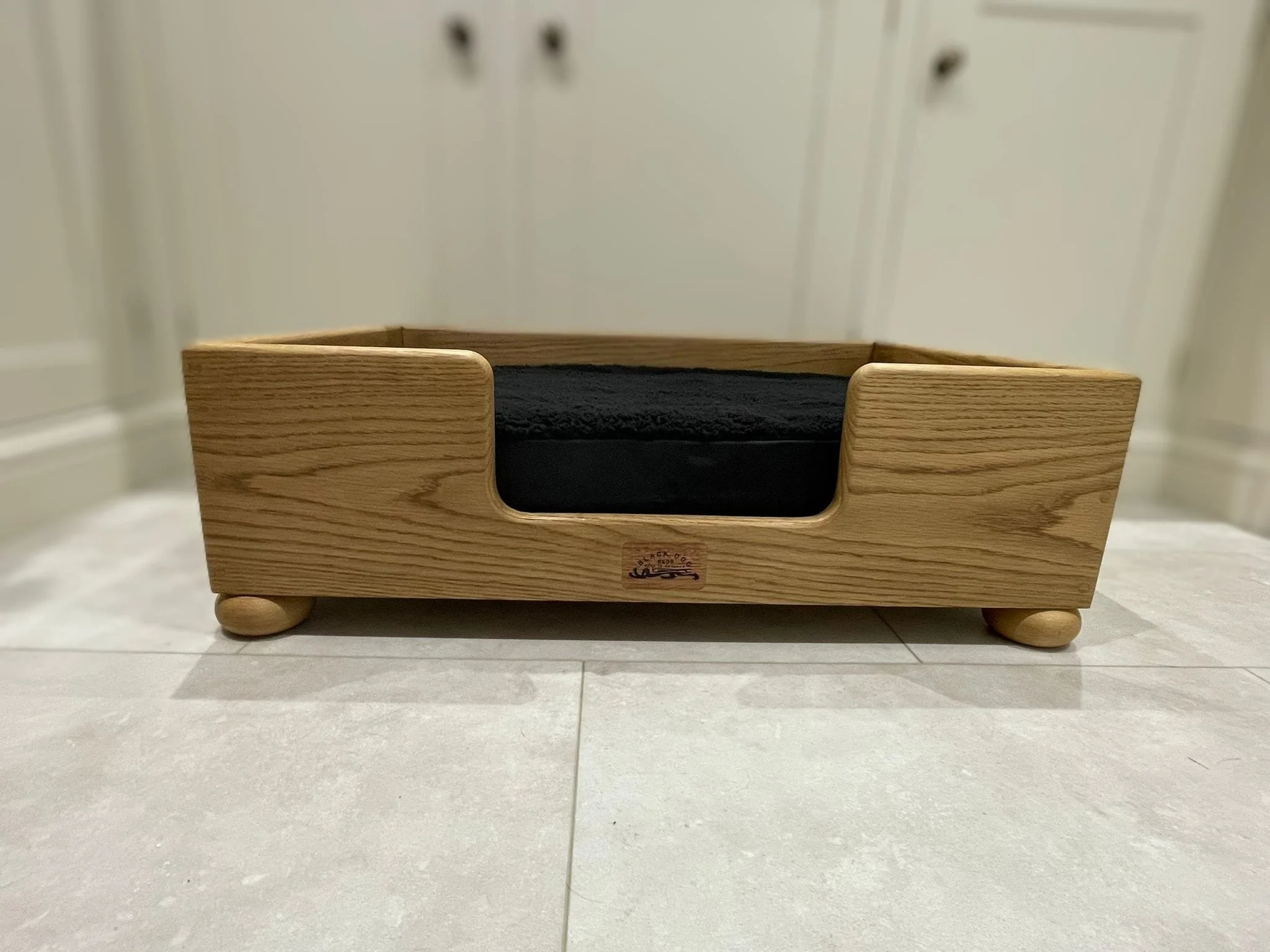 "Barren" oak frame finished in dark.