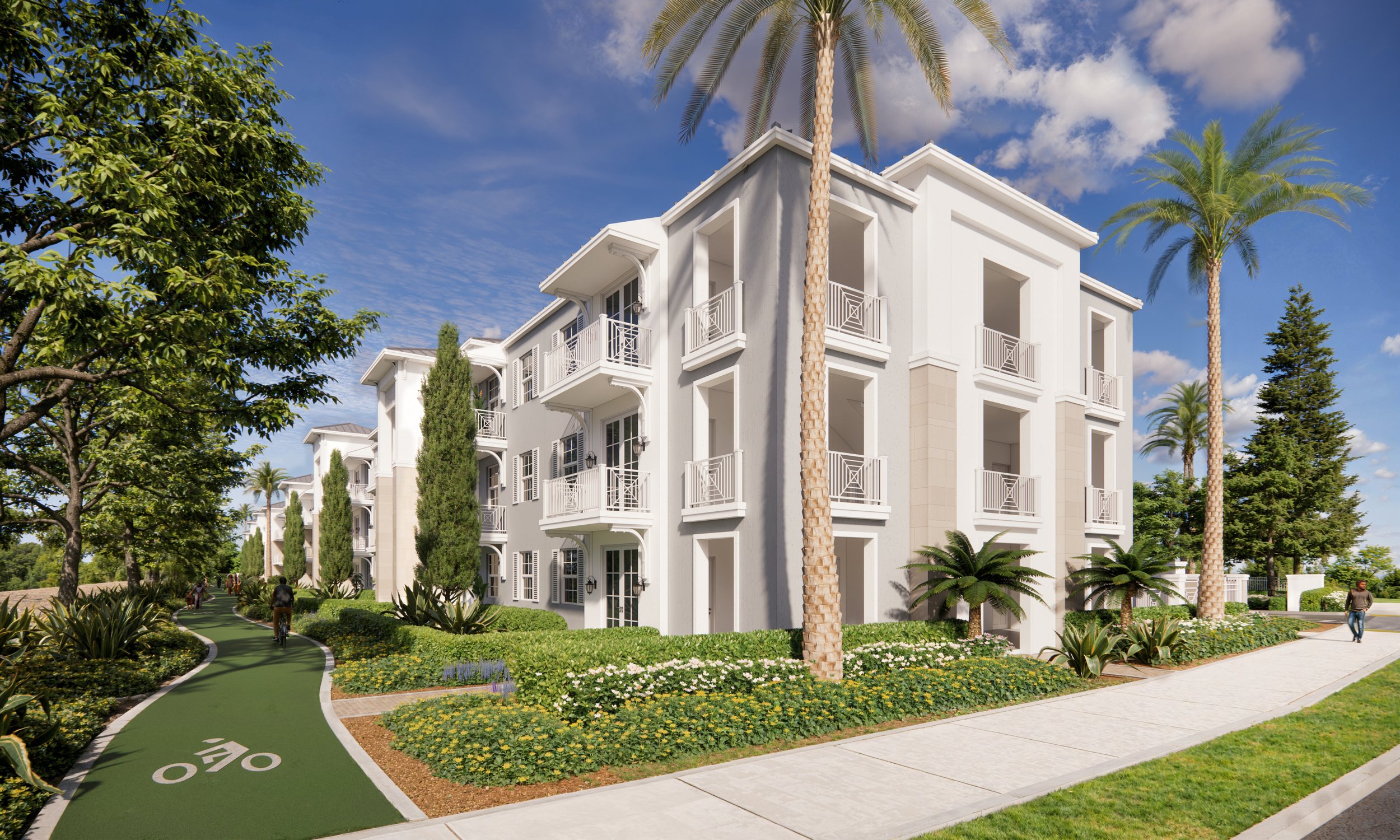 A modern white apartment building surrounded by palm trees and lush greenery, with a green bike lane and sidewalk in the foreground.