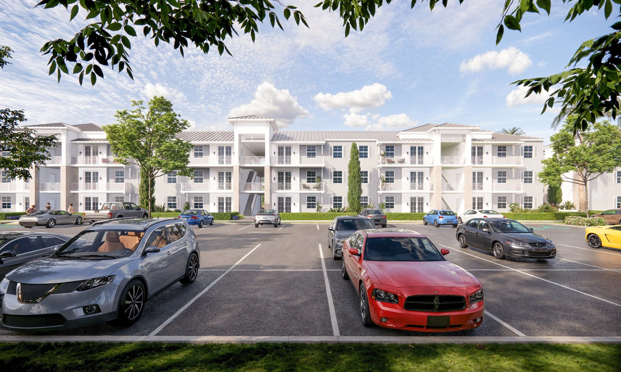 A parking lot in front of a white three-story apartment building with balconies, surrounded by trees and parked cars, under a partly cloudy sky.