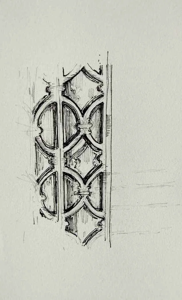 Sketch of an ornate decorative wrought iron or wooden gate with arches and intricate design.