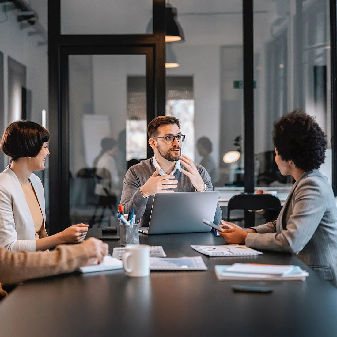 investment team consulting with clients