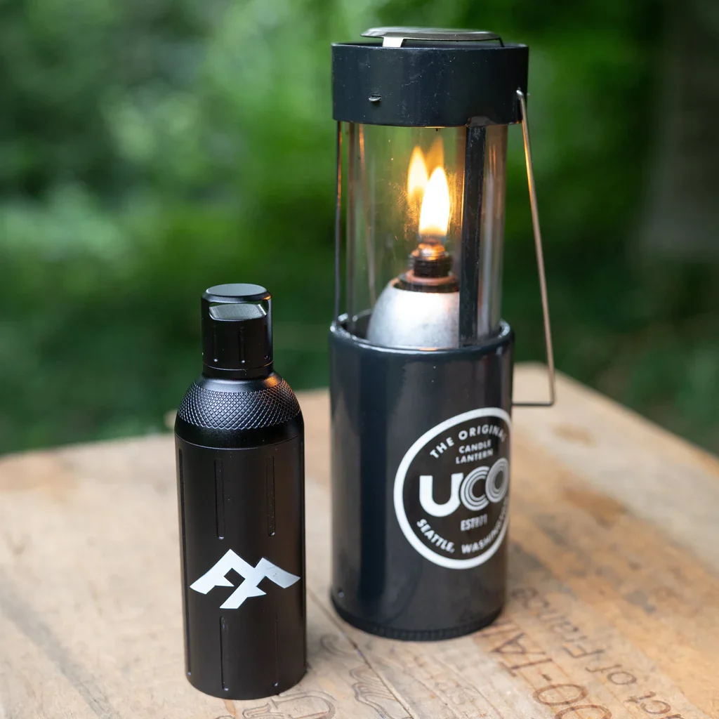 Forest Fundamentals oil insert for UCO lantern in outdoor woodland setting