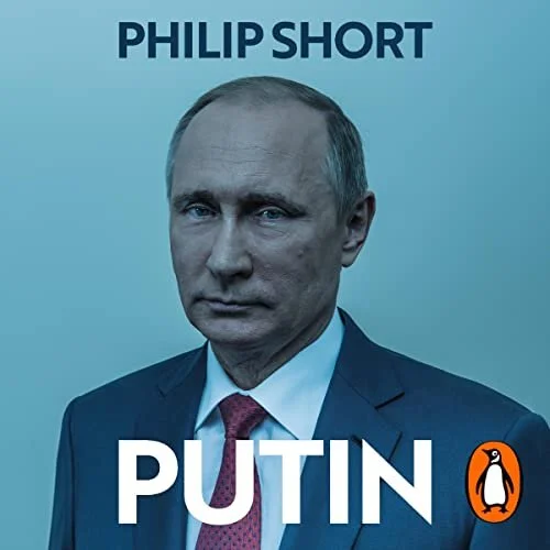 Book cover featuring a serious portrait of Vladimir Putin, with the title "PUTIN" and author "Philip Short" at the top, published by Penguin.