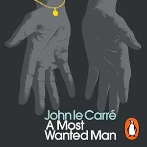 Black and white illustration of two hands, one with a gold chain necklace, positioned against a dark background. Text reads 'John le Carré A Most Wanted Man' with an orange and white penguin logo.