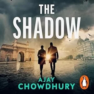 Book cover for 'The Shadow' by Ajay Chowdhury, showing two silhouetted people walking with a cityscape and dark, cloudy sky in the background.