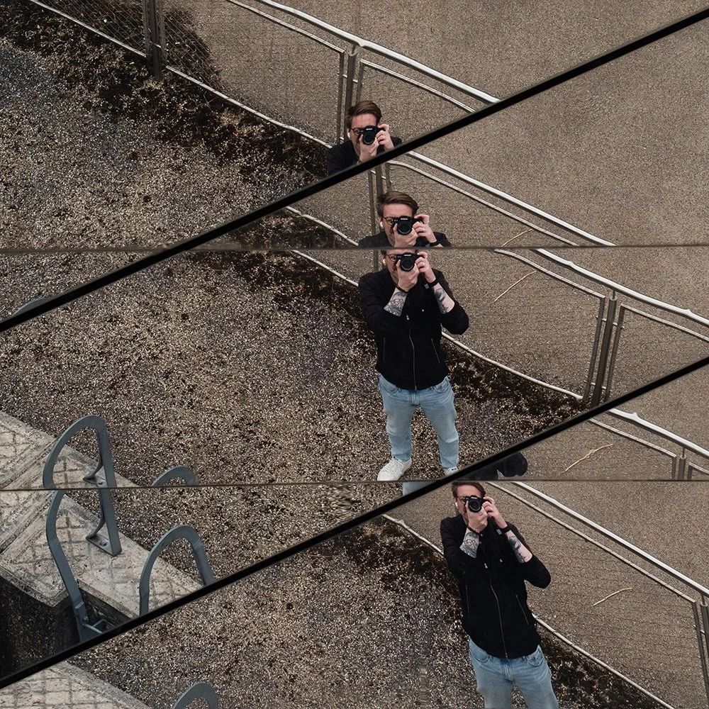 Reflection of photographer pointing the camera upwards.