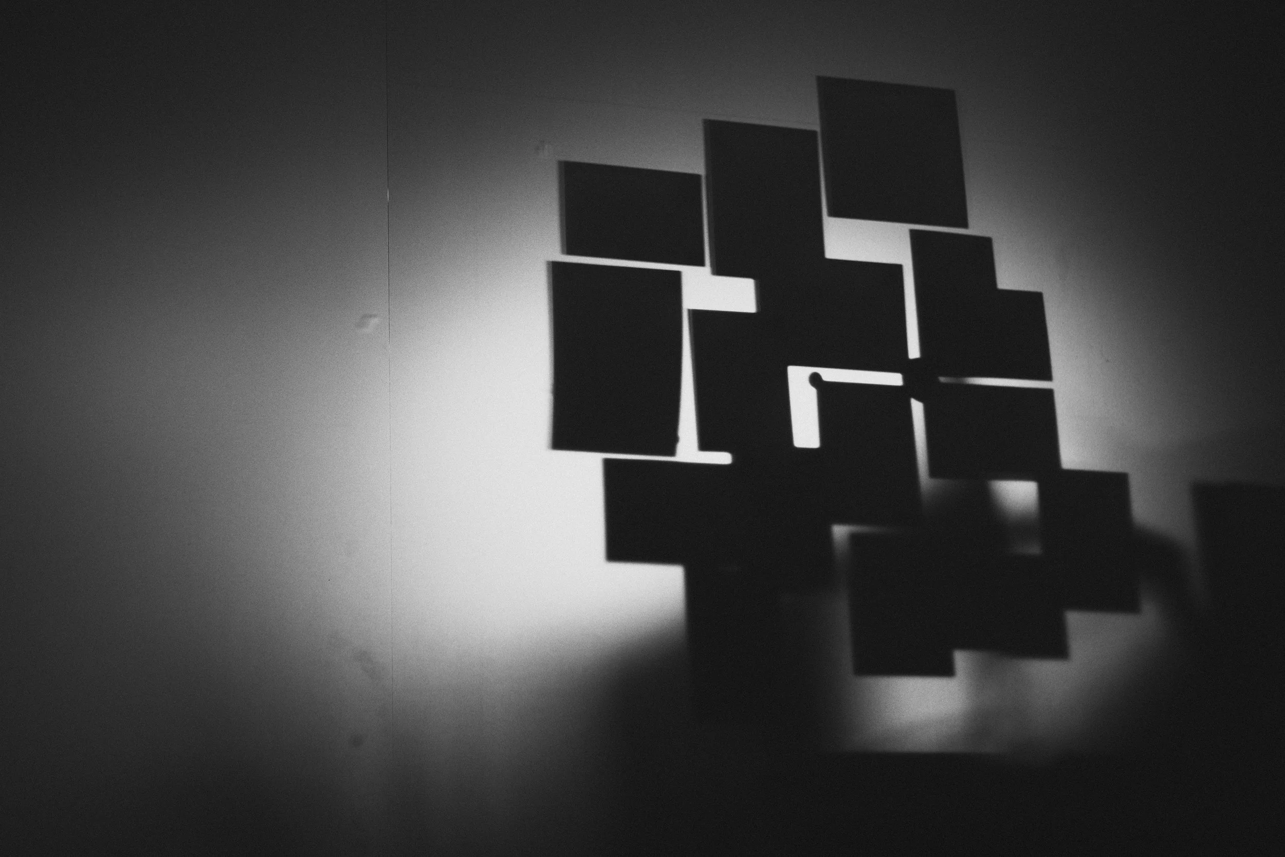 Paper notes taped to a frosted glass pane, lit from behind. 