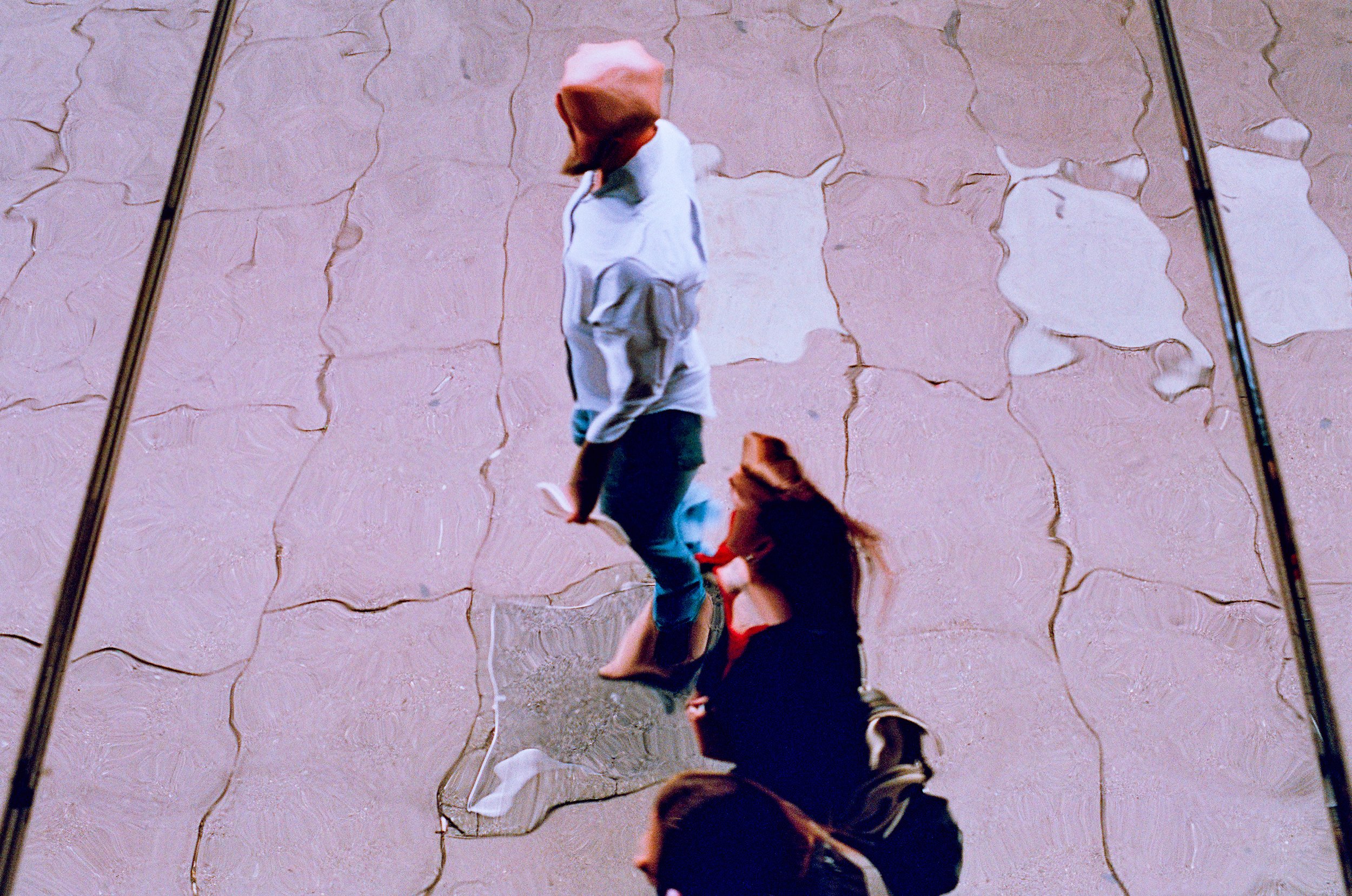 Distorted of two people walking by. 