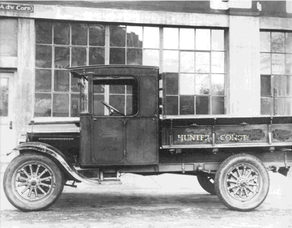 Our grandfathers truck outside a building he was repairing the sinking foundation on in downtown Wichita, KS circa 1928.