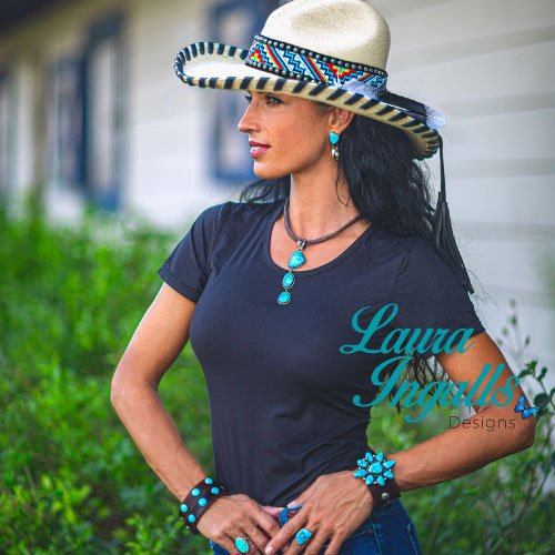 A woman wearing a wide-brimmed hat with natural turquoise jewelry