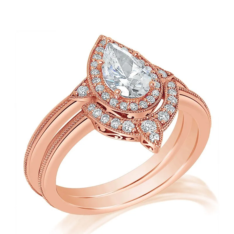 A rose gold ring set with a teardrop-shaped center diamond surrounded by small round diamonds.