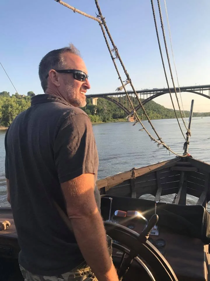 image of owner, Dan Kellogg, captaining a pirate ship