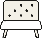 A piece of white cheese with black peppercorns inside, on a black background.