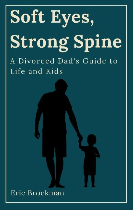 Book cover titled 'Soft Eyes, Strong Spine: A Divorced Dad's Guide to Life and Kids' by Eric Brockman, featuring a silhouette of a father holding his child's hand.